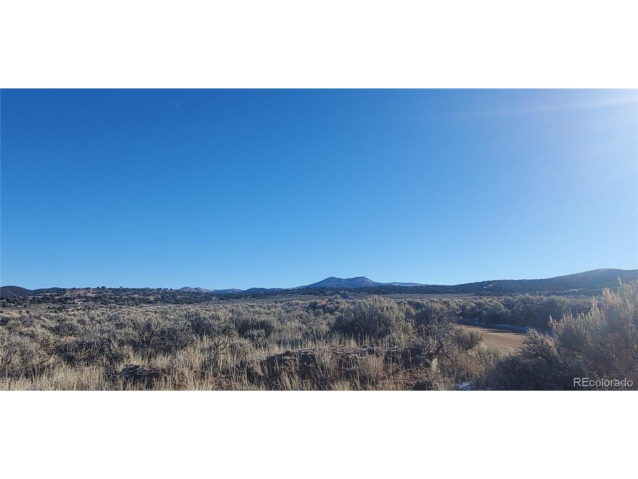 4125 Woodman Road Fort Garland, CO 81133 - Photo 4 of 14 a view of mountain with sunset