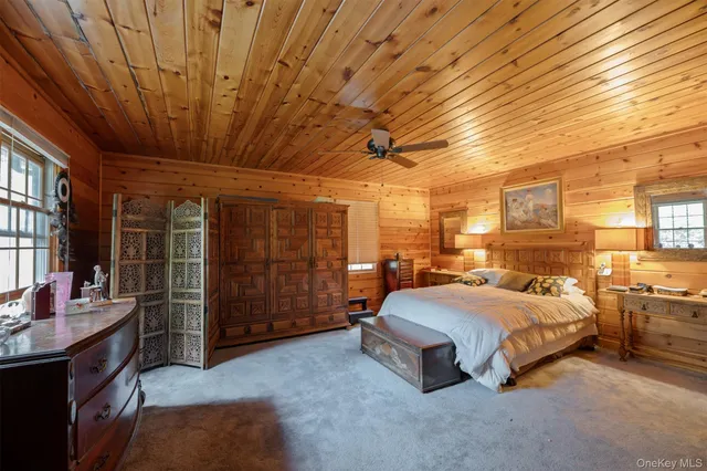 a bedroom with a bed and a desk