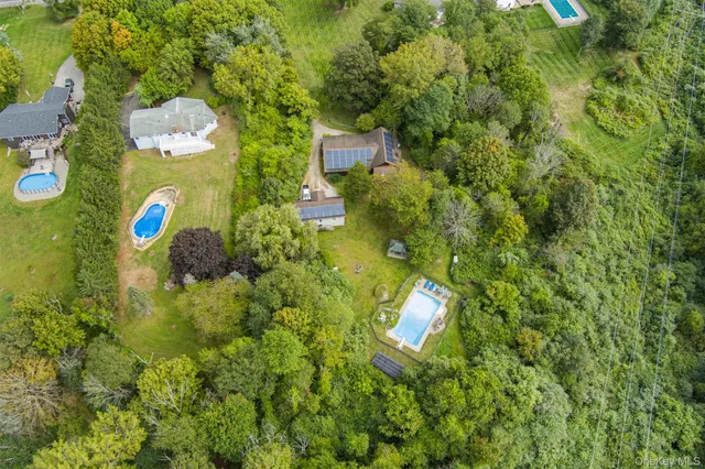 a view of a flower garden with a building