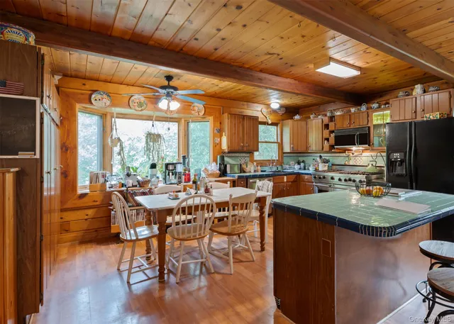a view of a dining room with furniture window and outside view