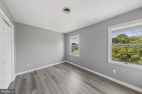 a view of room with window and ceiling fan