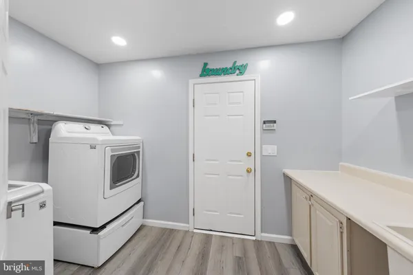 a view of storage and utility room with washer and dryer