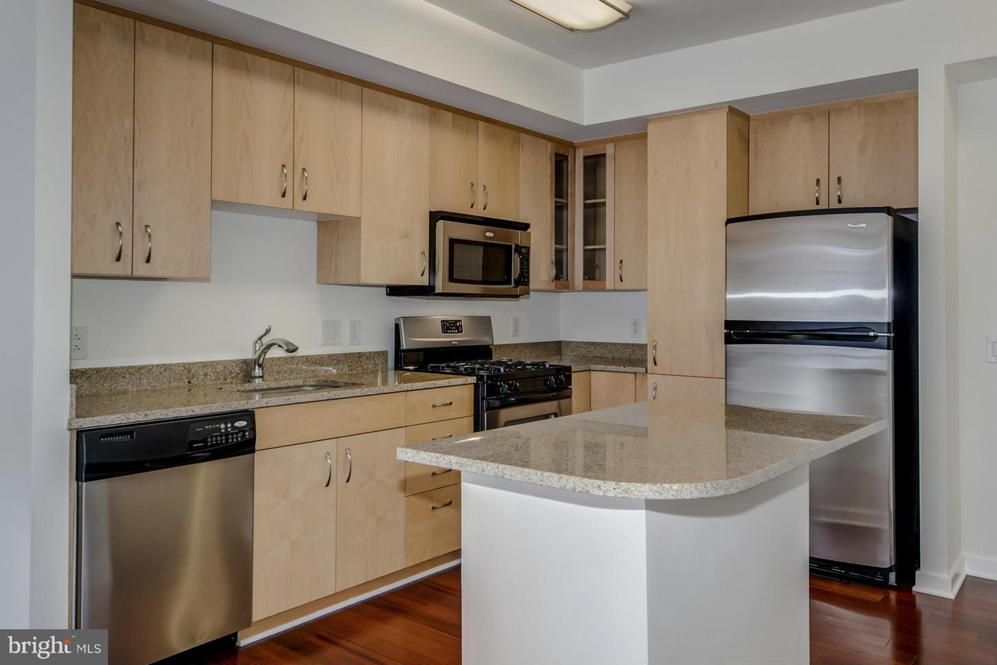 475 K Street Northwest, Unit 720 Washington, DC 20001 - Photo 2 of 23 a kitchen with appliances a sink and cabinets