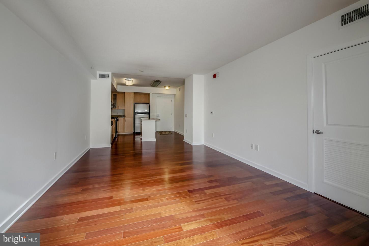 475 K Street Northwest, Unit 720 Washington, DC 20001 - Photo 4 of 23 a view of empty room with wooden floor