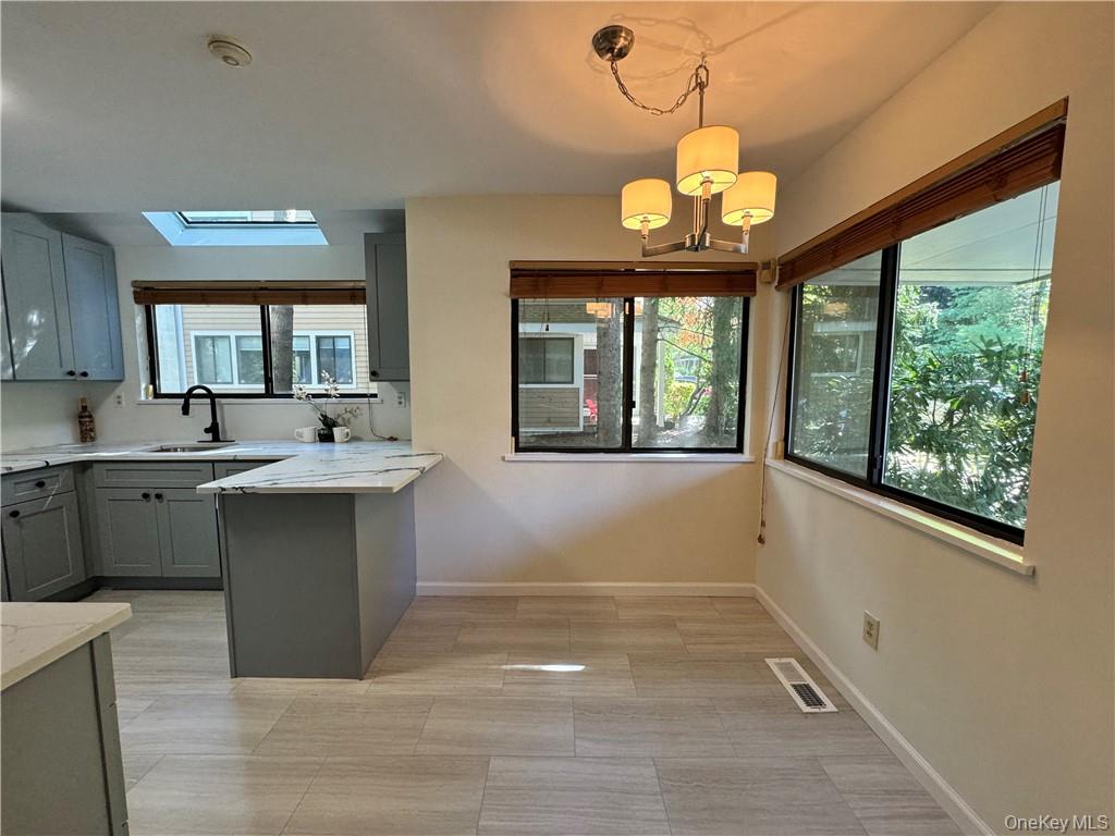 17 Rambling Brook Road Chappaqua, NY 10514 - Photo 5 of 32 Spacious updated eat in kitchen with large windows providing abundance of natural light