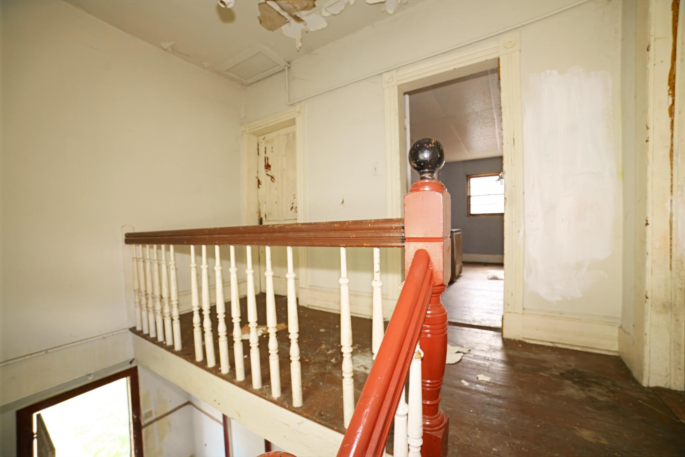 332 East Prospect Street Covington, VA 24426 - Photo 31 of 54 a view of a hallway with wooden floor and stairs