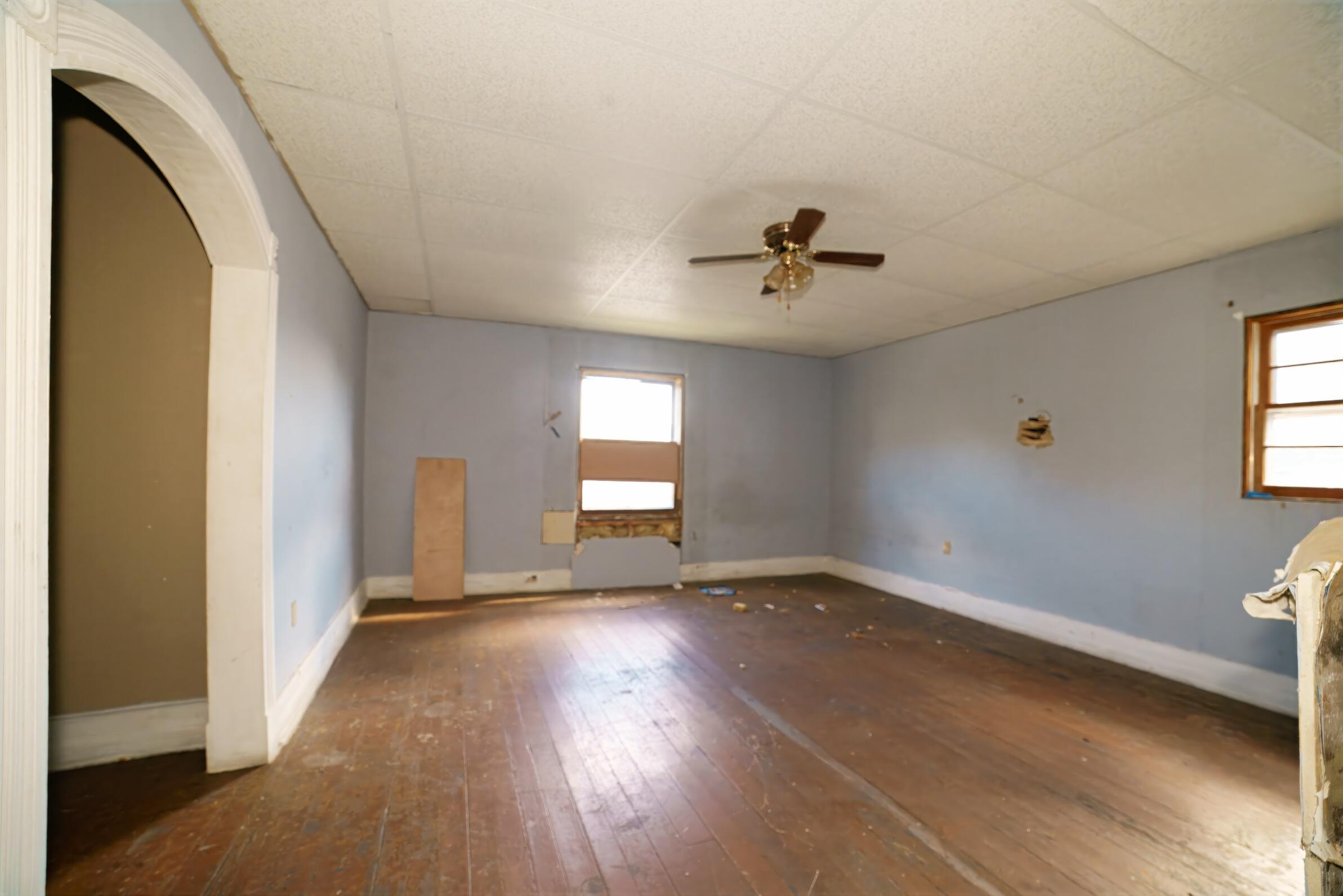 332 East Prospect Street Covington, VA 24426 - Photo 34 of 54 a view of an empty room with a window and wooden floor