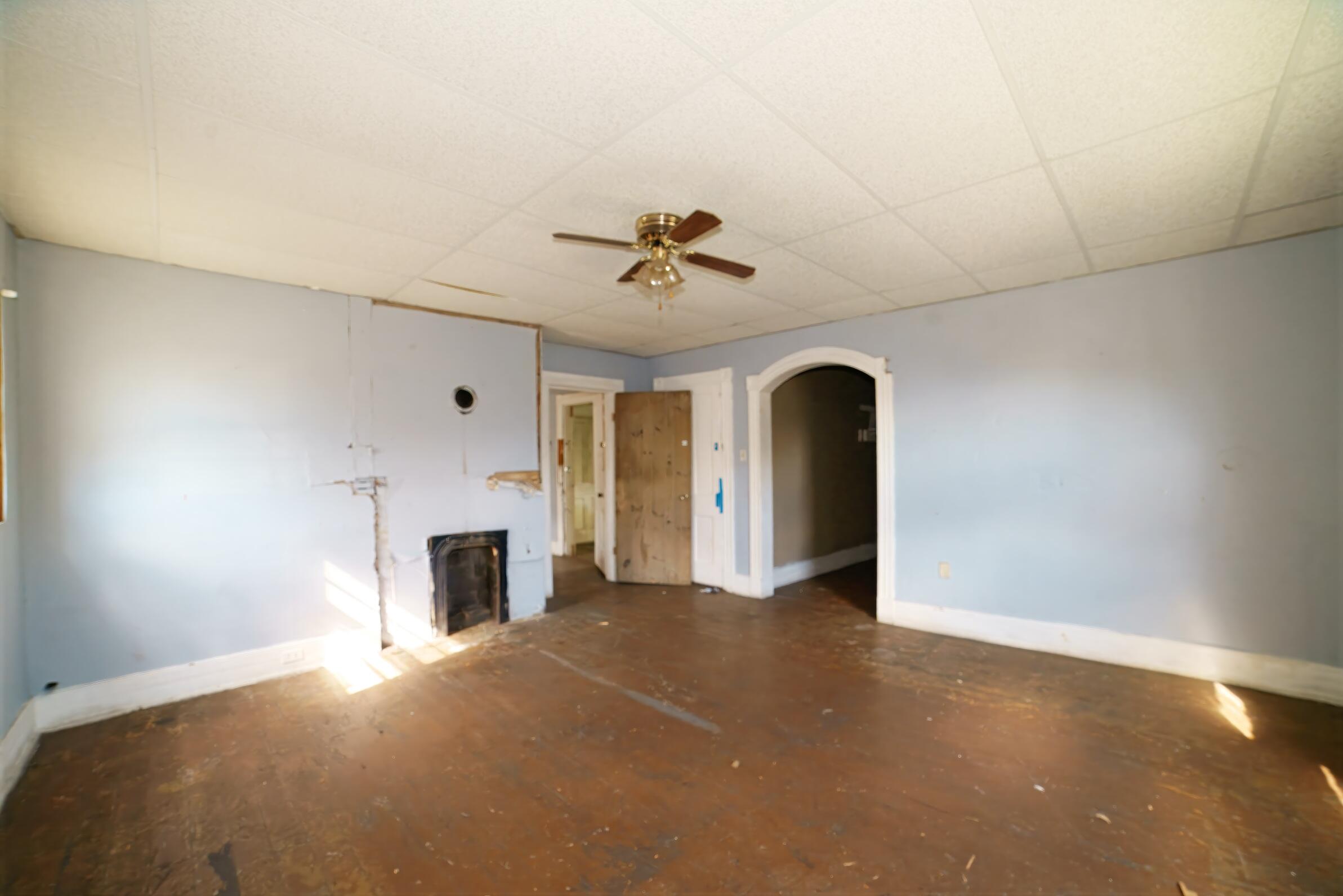 332 East Prospect Street Covington, VA 24426 - Photo 38 of 54 a view of a livingroom with a fireplace and a ceiling fan