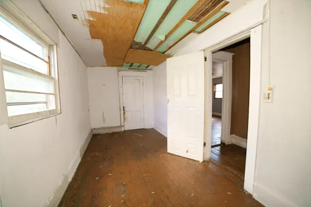 a view of a livingroom with furniture and windows