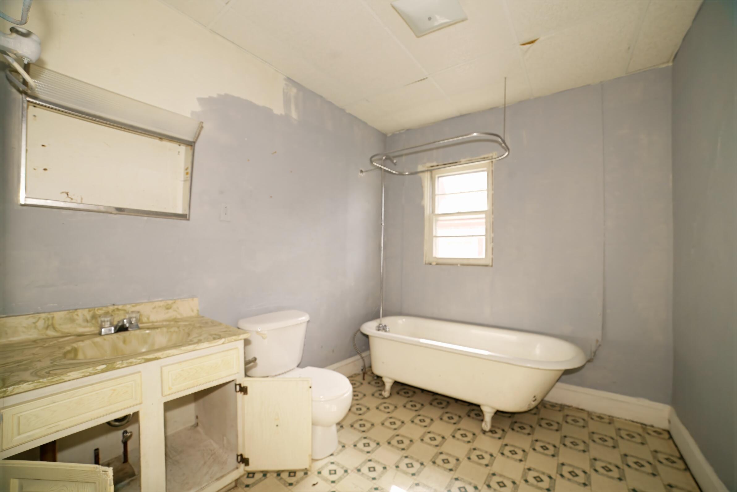332 East Prospect Street Covington, VA 24426 - Photo 44 of 54 a bathroom with a sink toilet a mirror and shower