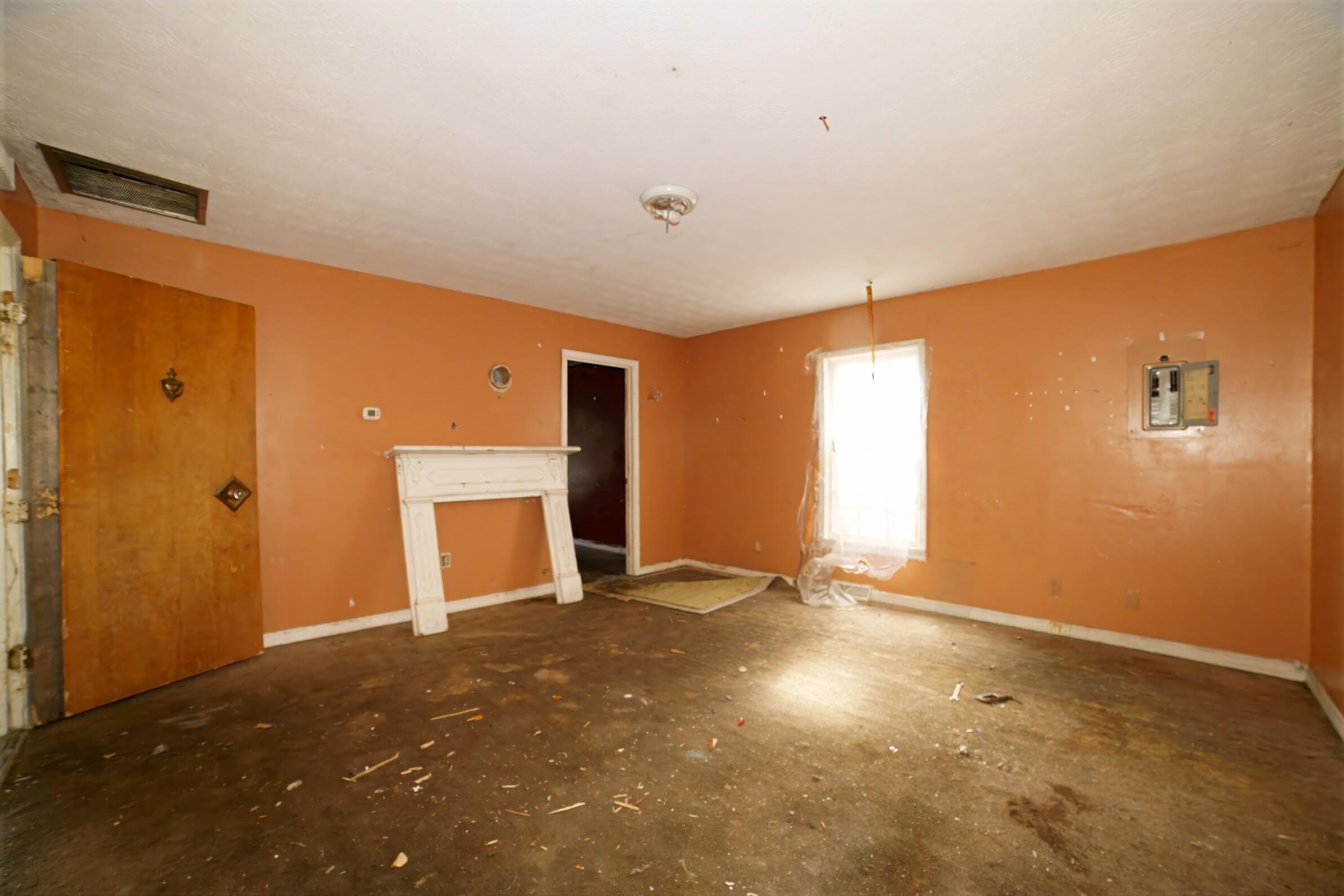 332 East Prospect Street Covington, VA 24426 - Photo 9 of 54 a view of an empty room with a fireplace