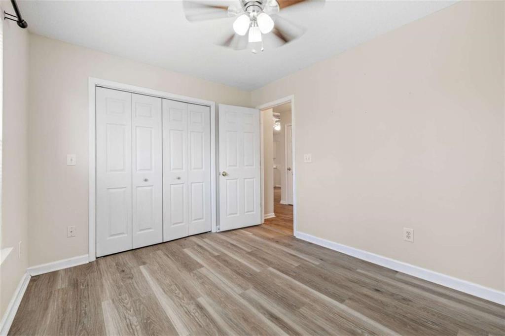226 Chestnut Avenue Demorest, GA 30535 - Photo 21 of 47 a view of a room with wooden floor and ceiling fan