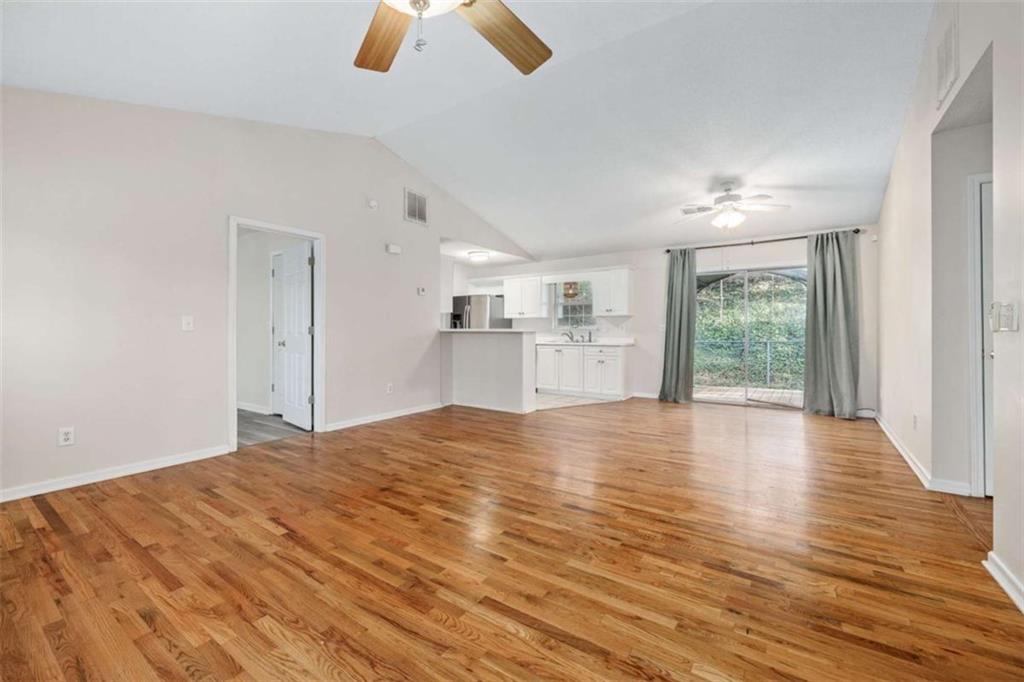 226 Chestnut Avenue Demorest, GA 30535 - Photo 9 of 47 a view of empty room with wooden floor and window