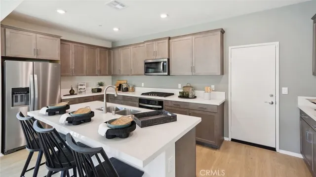 a kitchen with a dining table and chairs