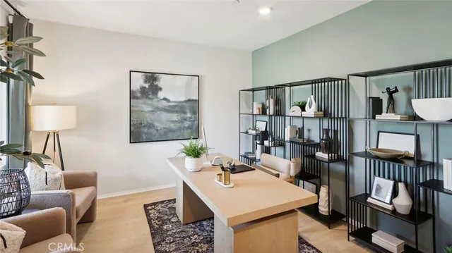a living room with furniture a rug and a window