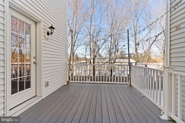 a view of a wooden deck with a yard