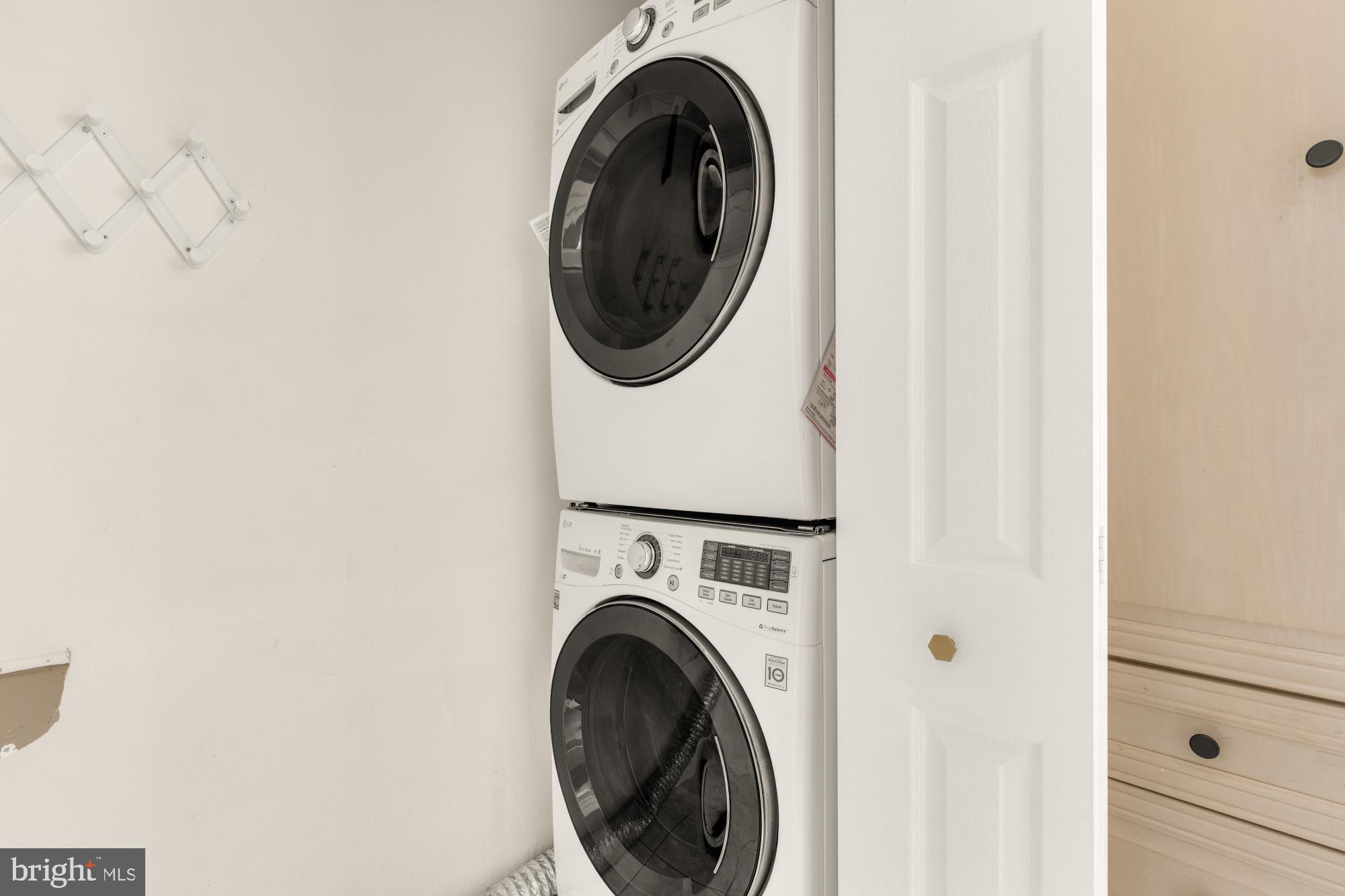 45 Windbrooke Circle, Unit 45 Gaithersburg, MD 20879 - Photo 17 of 29 a utility room with dryer and washer