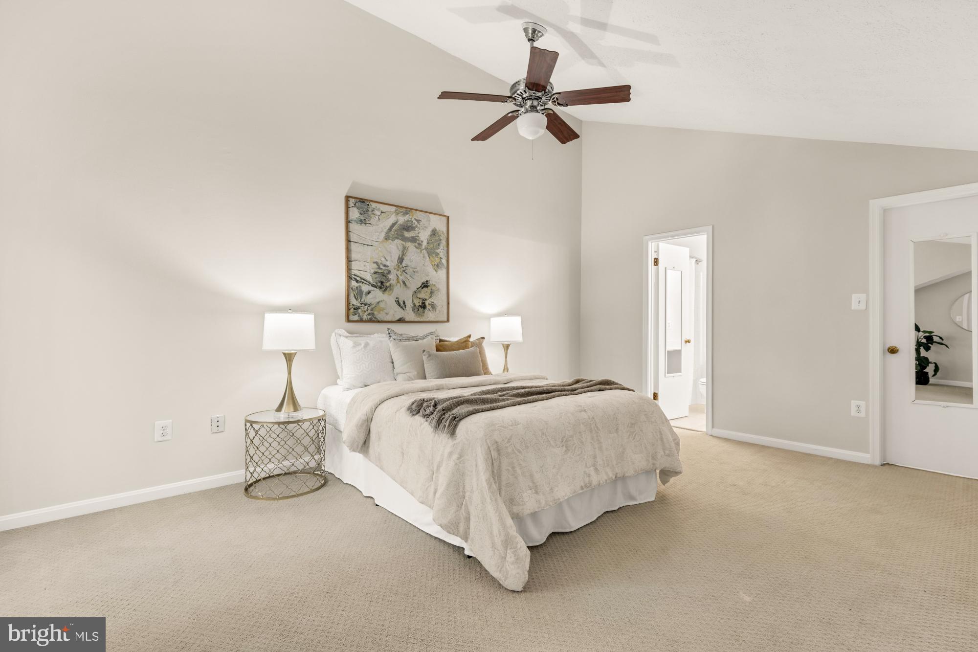 45 Windbrooke Circle, Unit 45 Gaithersburg, MD 20879 - Photo 23 of 29 a bed room with a bed and a ceiling fan