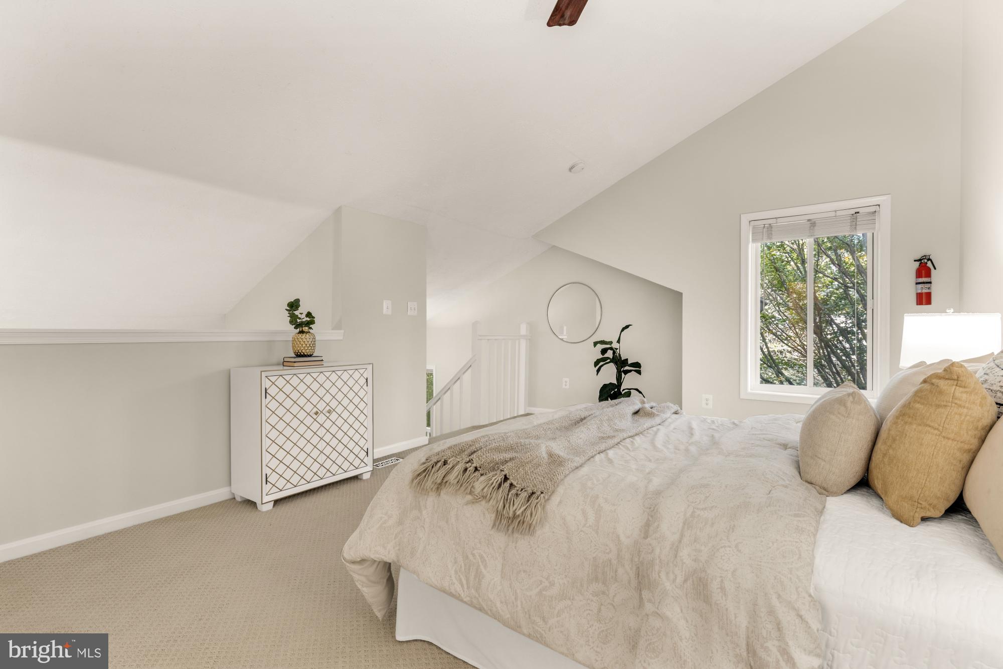 45 Windbrooke Circle, Unit 45 Gaithersburg, MD 20879 - Photo 25 of 29 a bedroom with a bed and a large window