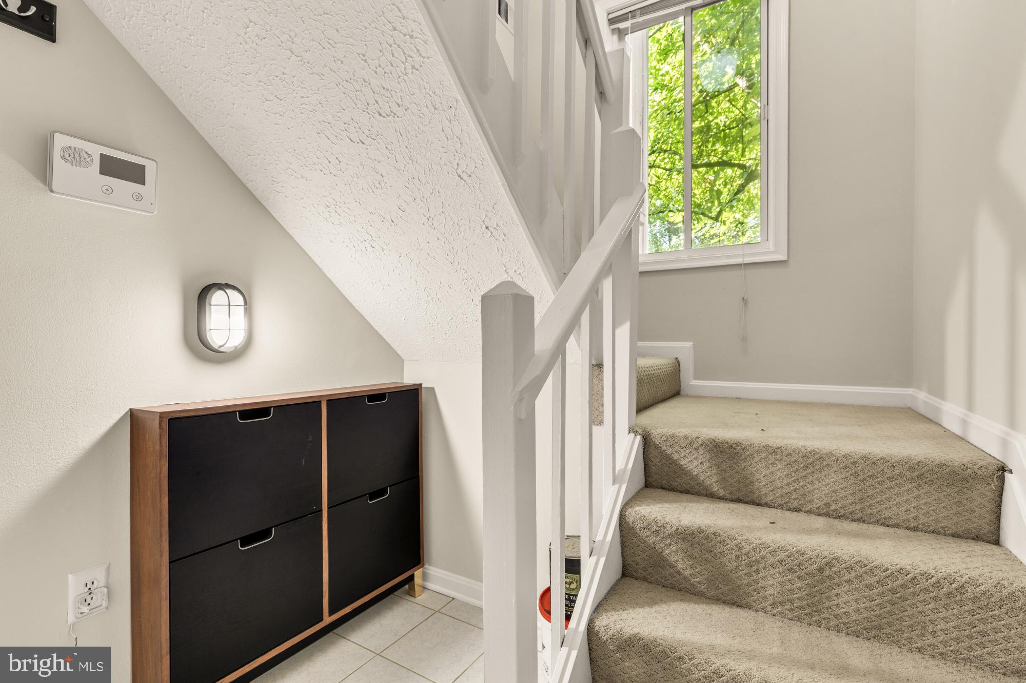 45 Windbrooke Circle, Unit 45 Gaithersburg, MD 20879 - Photo 4 of 29 a living room with furniture and a window