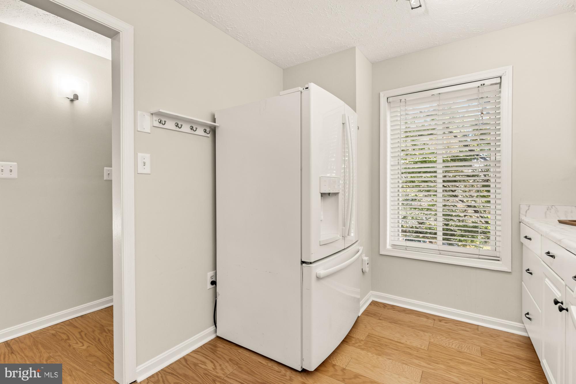 45 Windbrooke Circle, Unit 45 Gaithersburg, MD 20879 - Photo 6 of 29 a view of an empty room with a window