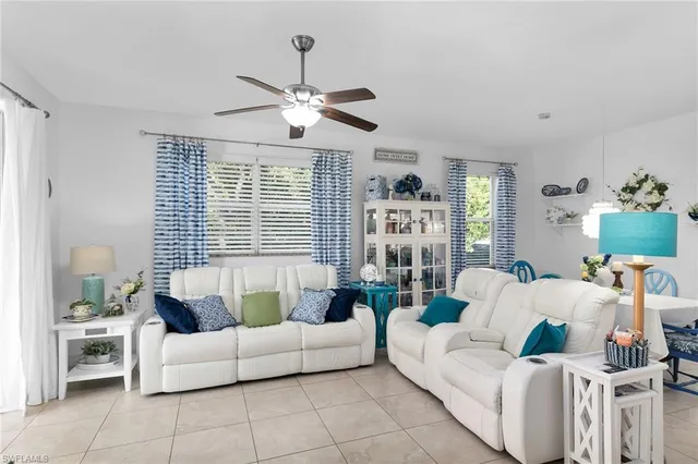 a living room with furniture and white walls