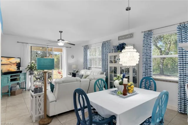 a dining room with furniture and window