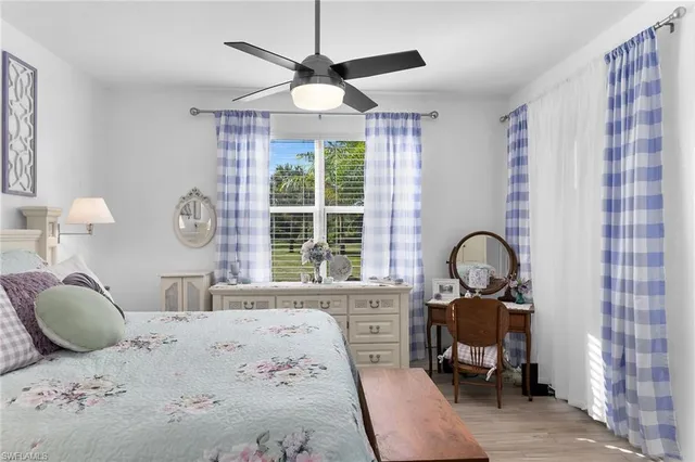 a bathroom with a sink vanity mirror shower and mirror