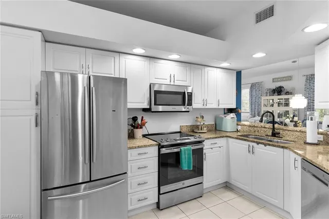 a room with a window and dresser