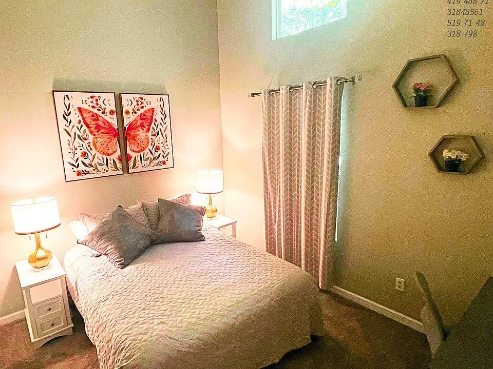 837 Forrest Circle Southeast Atlanta, GA 30354 - Photo 11 of 17 a bedroom with a bed and a window