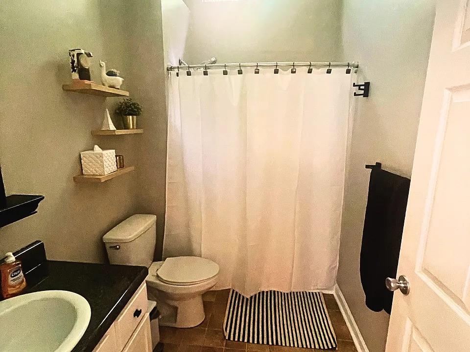 837 Forrest Circle Southeast Atlanta, GA 30354 - Photo 13 of 17 a bathroom with a toilet and a shower