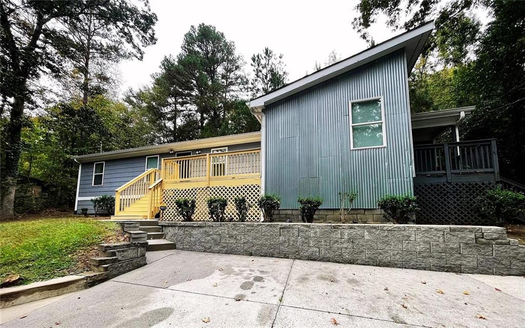 837 Forrest Circle Southeast Atlanta, GA 30354 - Photo 2 of 17 a front view of a house with garden