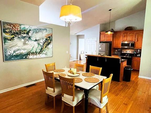 837 Forrest Circle Southeast Atlanta, GA 30354 - Photo 6 of 17 a view of a dining room with furniture wooden floor and chandelier