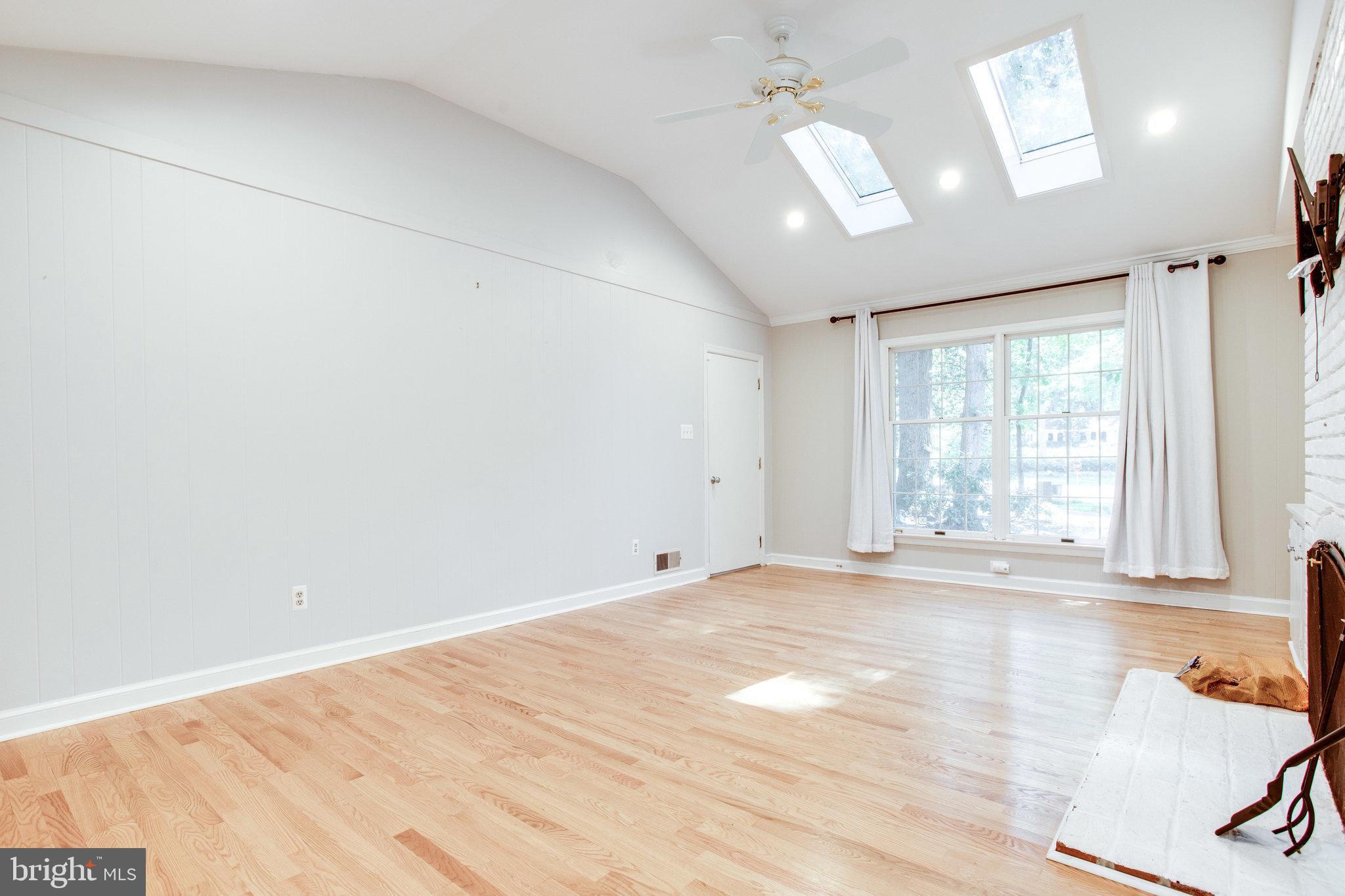 8500 Brook Road McLean, VA 22102 - Photo 22 of 59 an empty room with wooden floor and windows