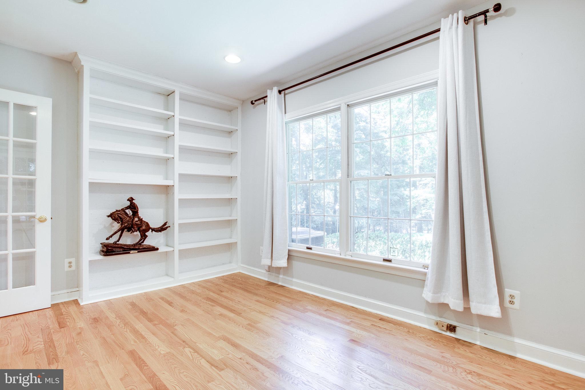 8500 Brook Road McLean, VA 22102 - Photo 25 of 59 a bedroom with a bed and a large window