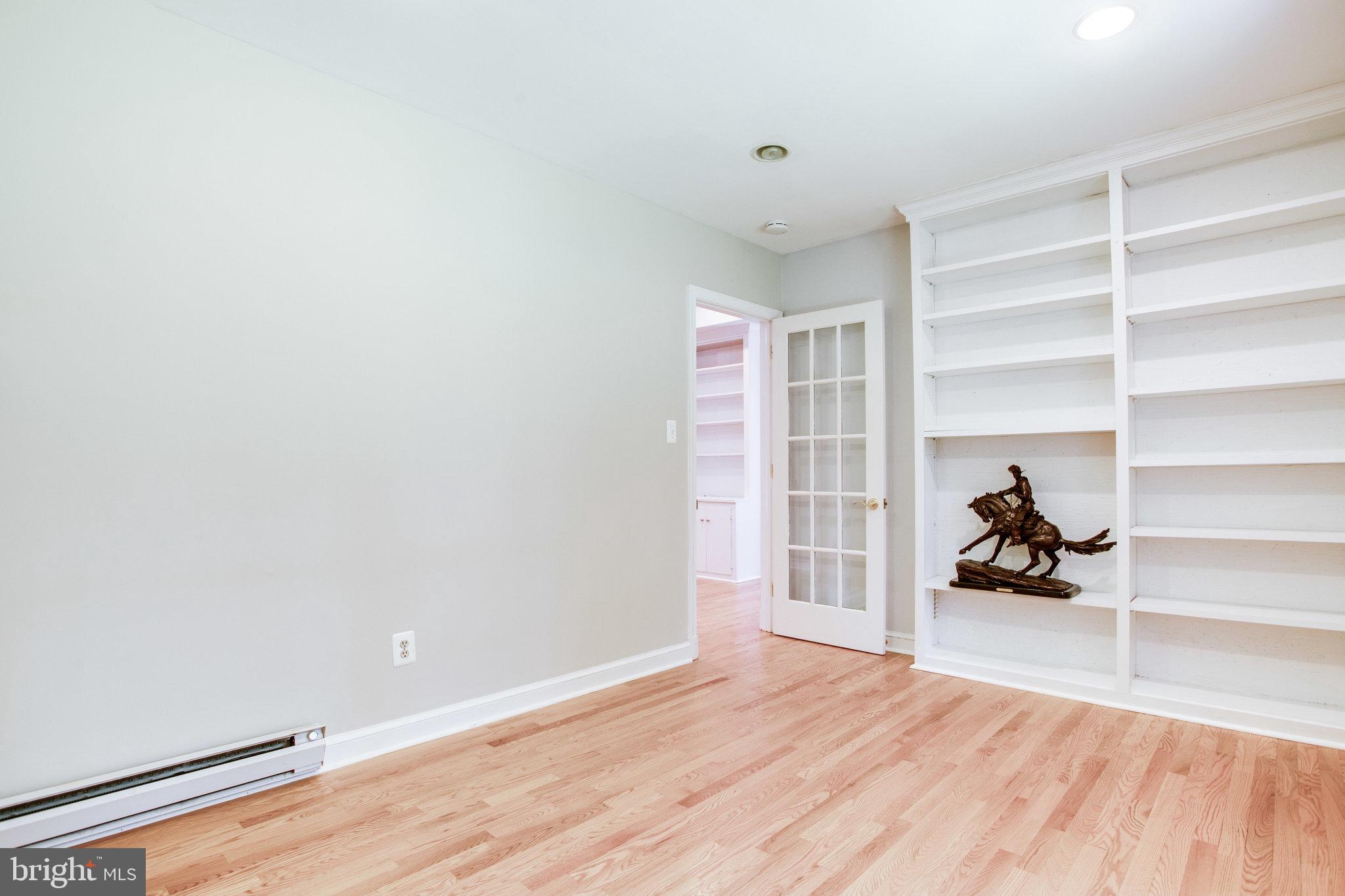 8500 Brook Road McLean, VA 22102 - Photo 26 of 59 a view of a livingroom with wooden floor and a rug