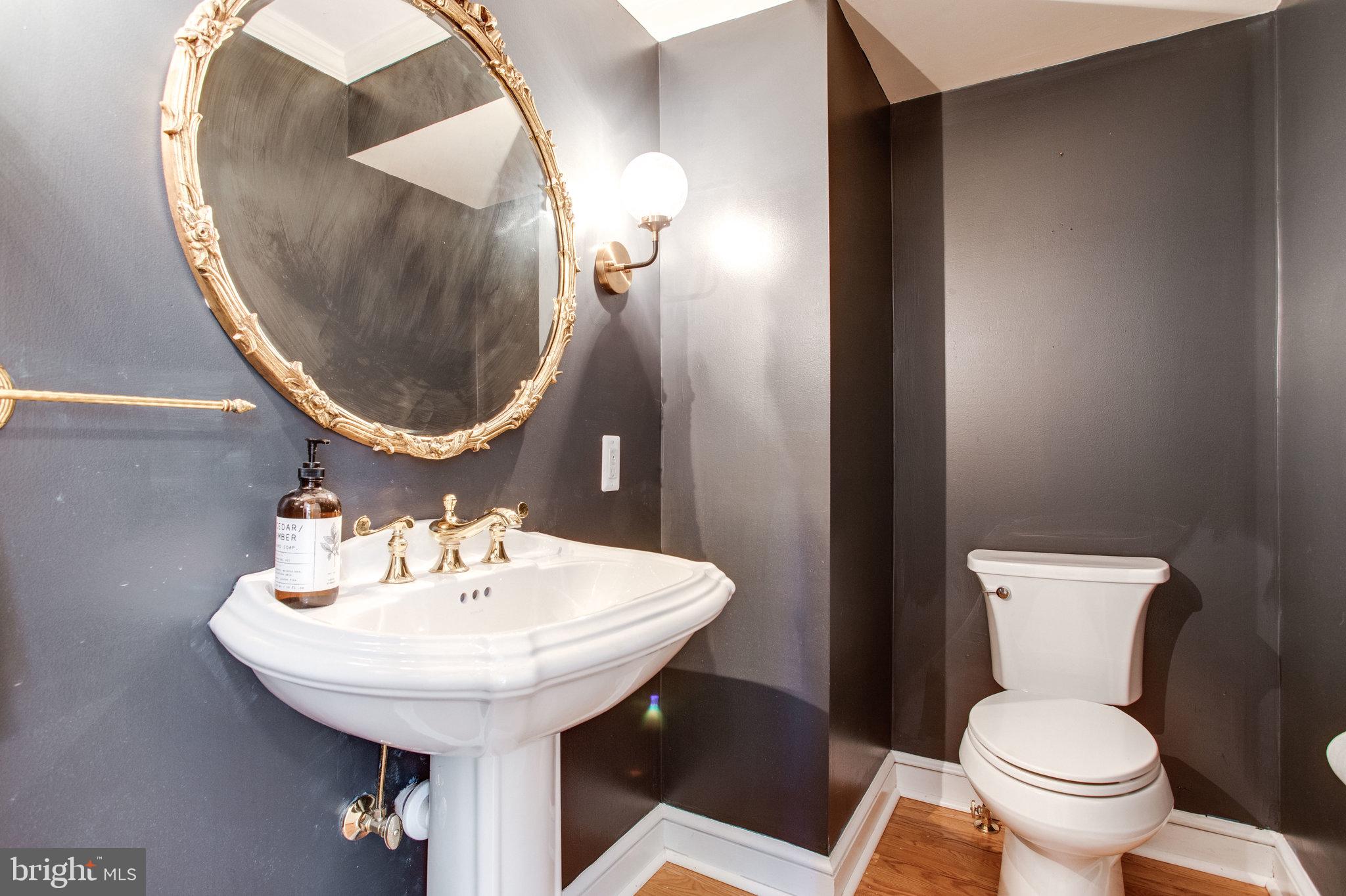 8500 Brook Road McLean, VA 22102 - Photo 27 of 59 a bathroom with a toilet sink and mirror