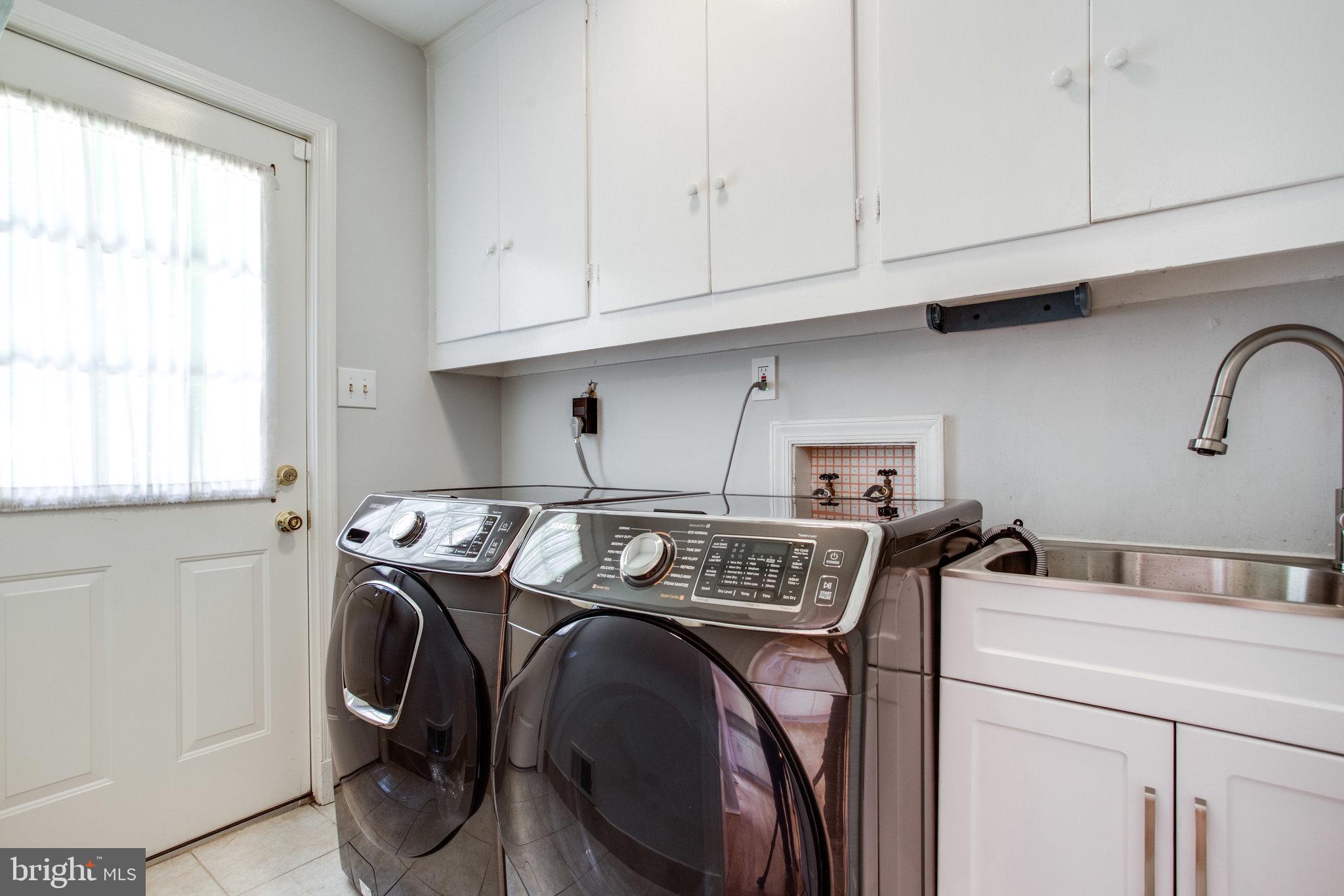 8500 Brook Road McLean, VA 22102 - Photo 28 of 59 a utility room with dryer and washer