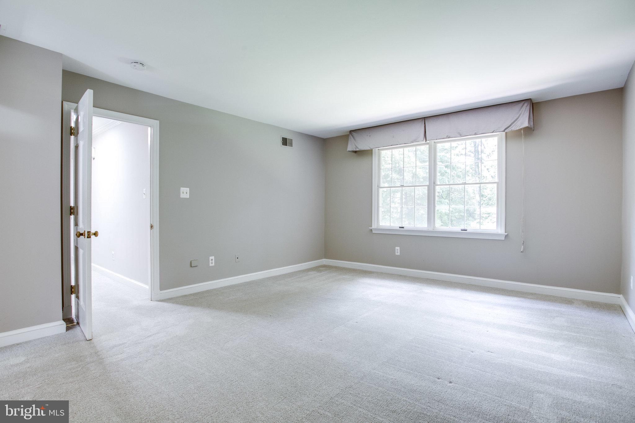 8500 Brook Road McLean, VA 22102 - Photo 32 of 59 an empty room with windows