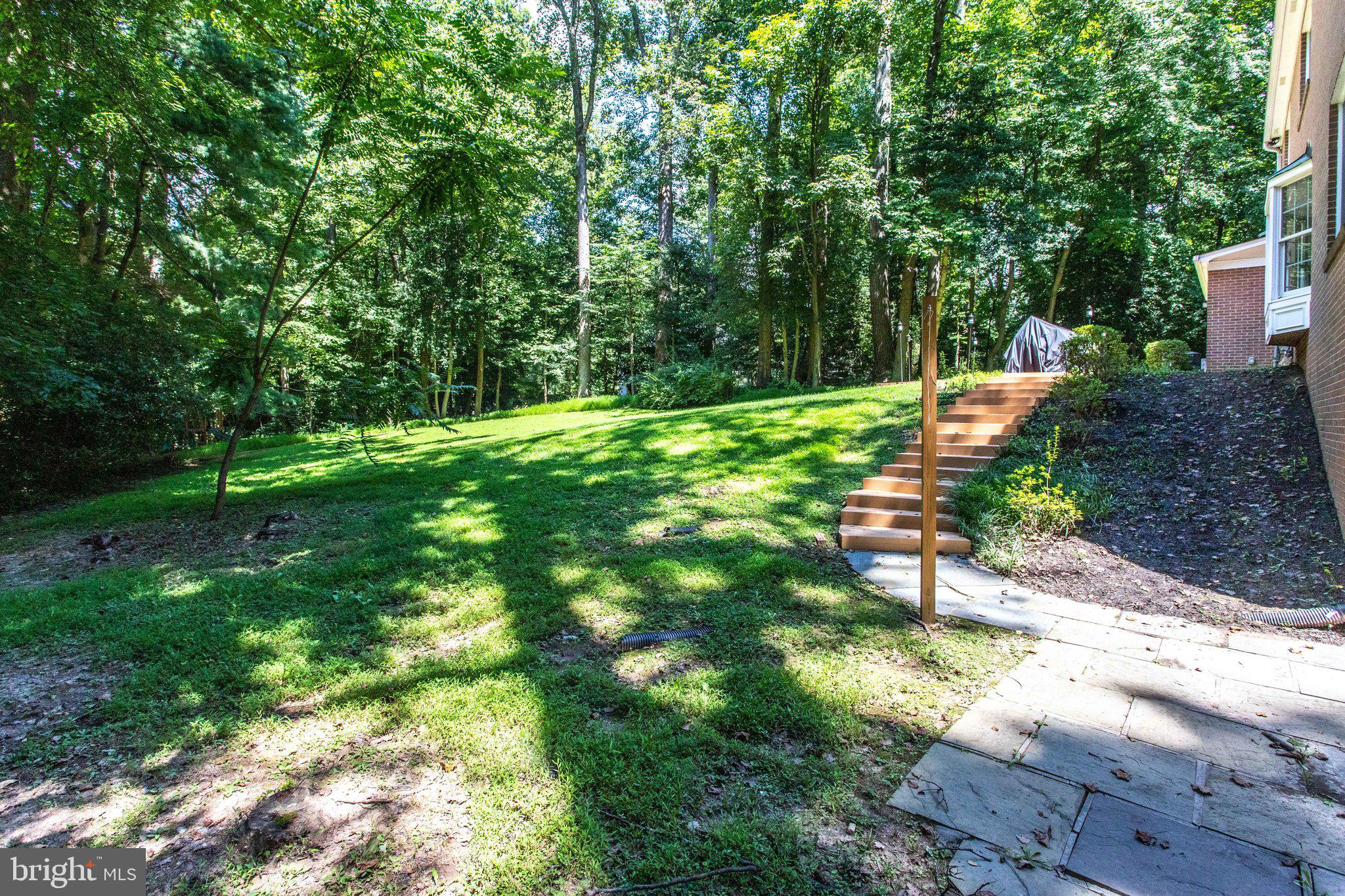 8500 Brook Road McLean, VA 22102 - Photo 56 of 59 a view of backyard with a table and chairs and wooden fence