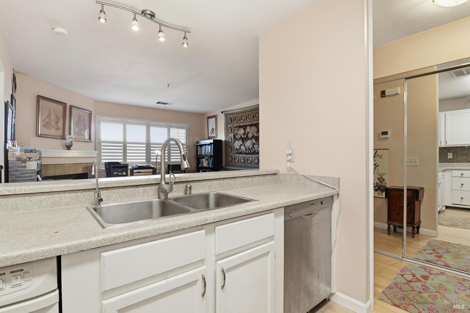 240 Seagull Row Novato, CA 94945 - Photo 16 of 33 a kitchen with stainless steel appliances granite countertop a sink and a refrigerator