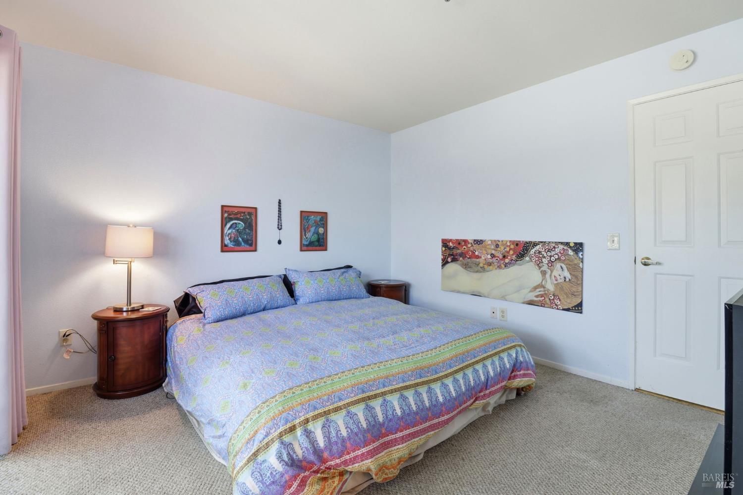 240 Seagull Row Novato, CA 94945 - Photo 20 of 33 a bedroom with a bed and a lamp