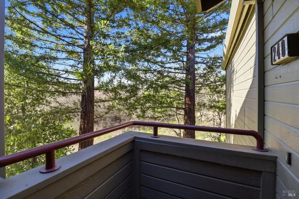 a view of balcony with wooden floor