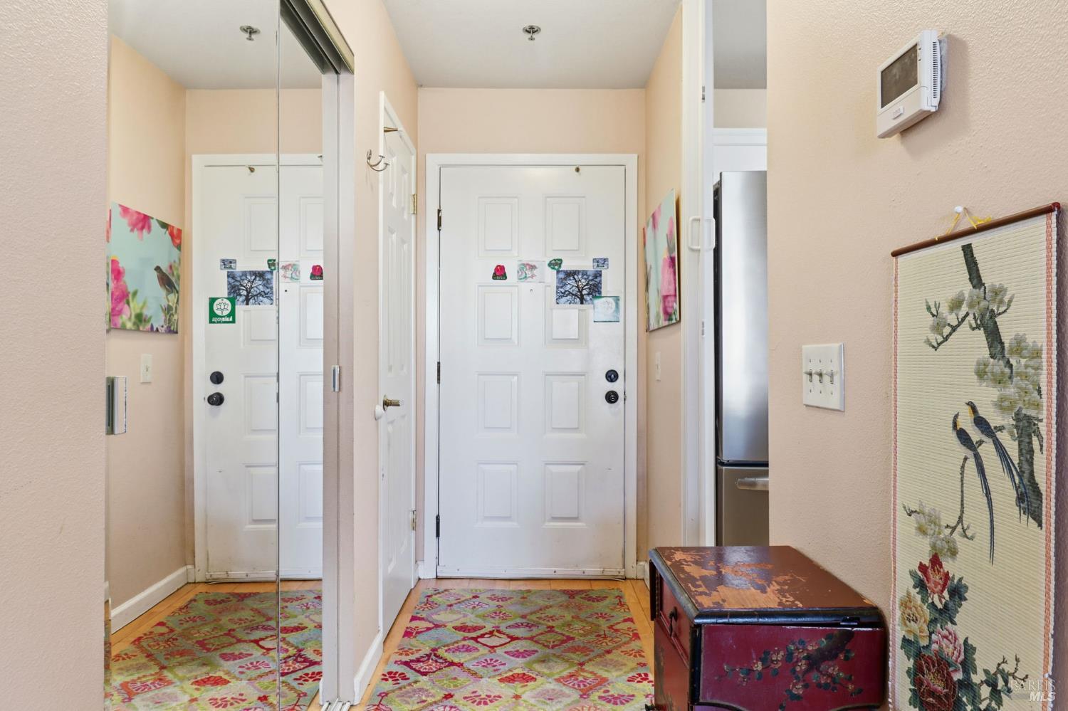 240 Seagull Row Novato, CA 94945 - Photo 21 of 29 Entry all with a large sliding closet, a coat closet and kitchen access.