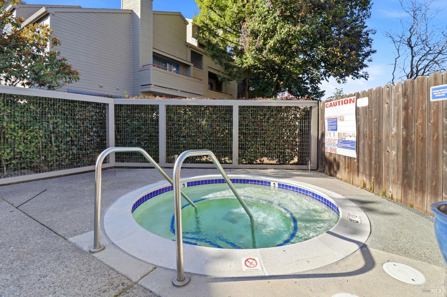 240 Seagull Row Novato, CA 94945 - Photo 25 of 33 a swimming pool with outdoor seating and yard