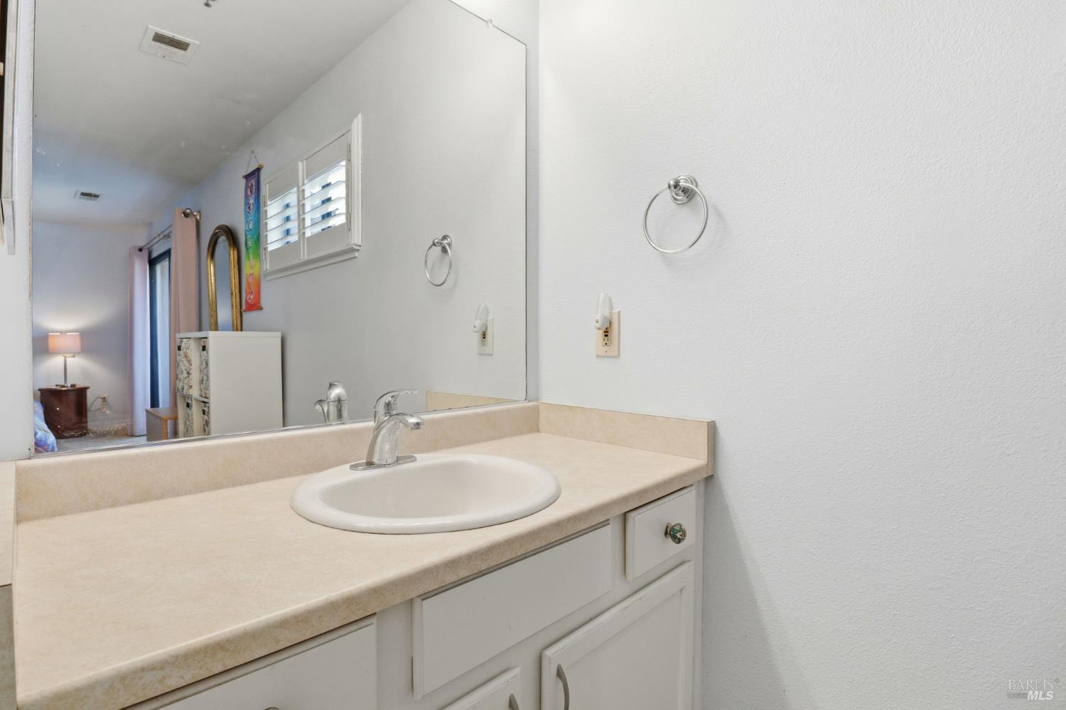 240 Seagull Row Novato, CA 94945 - Photo 26 of 33 a bathroom with a sink and a mirror