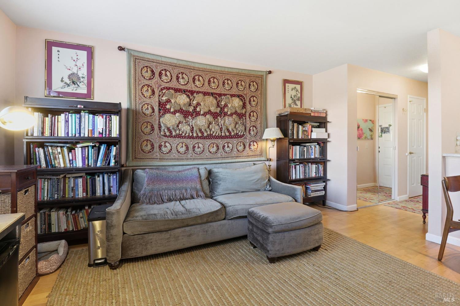 240 Seagull Row Novato, CA 94945 - Photo 6 of 29 a living room with furniture and a book shelf