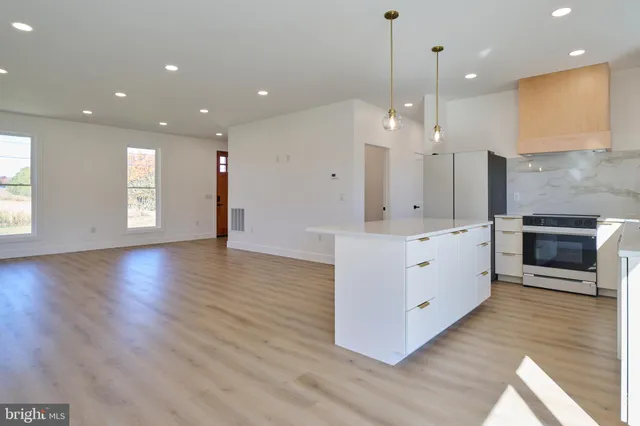 a kitchen with a sink cabinets and stainless steel appliances