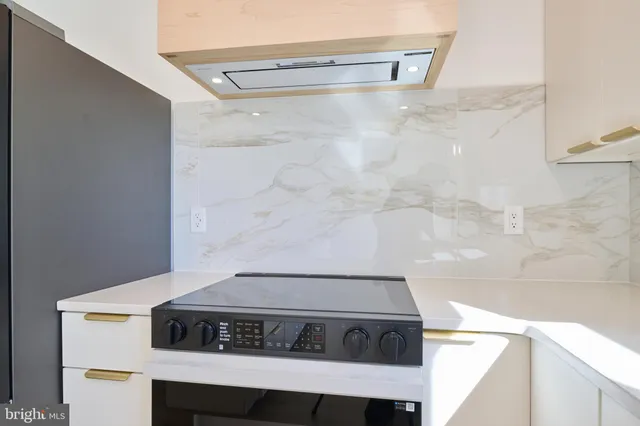 a kitchen with a sink and a window