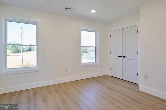 a bathroom with a sink vanity and mirror